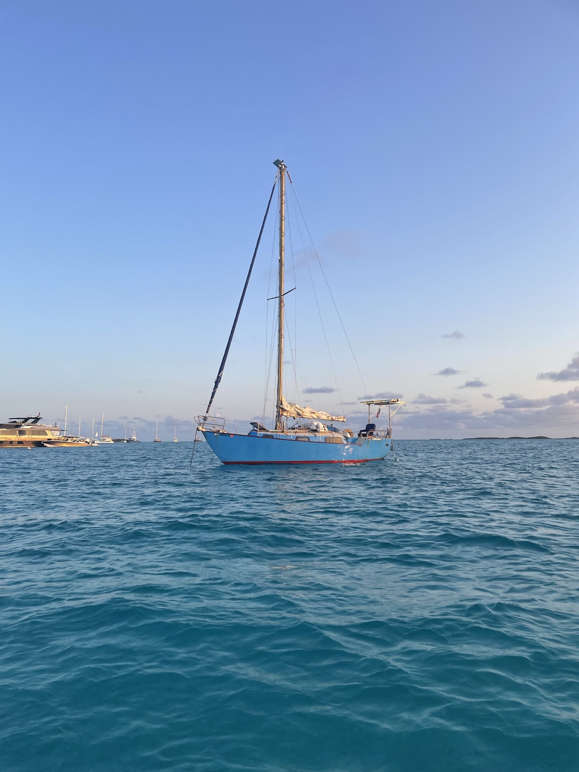 Boat anchored in blue water